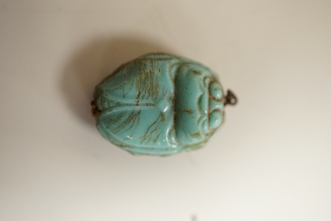 A Chinese carved rock crystal lion, a turquoise bead and a small quantity of marbles, lion 8.5cm wide